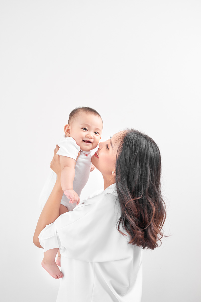 cover image - mother holding baby 